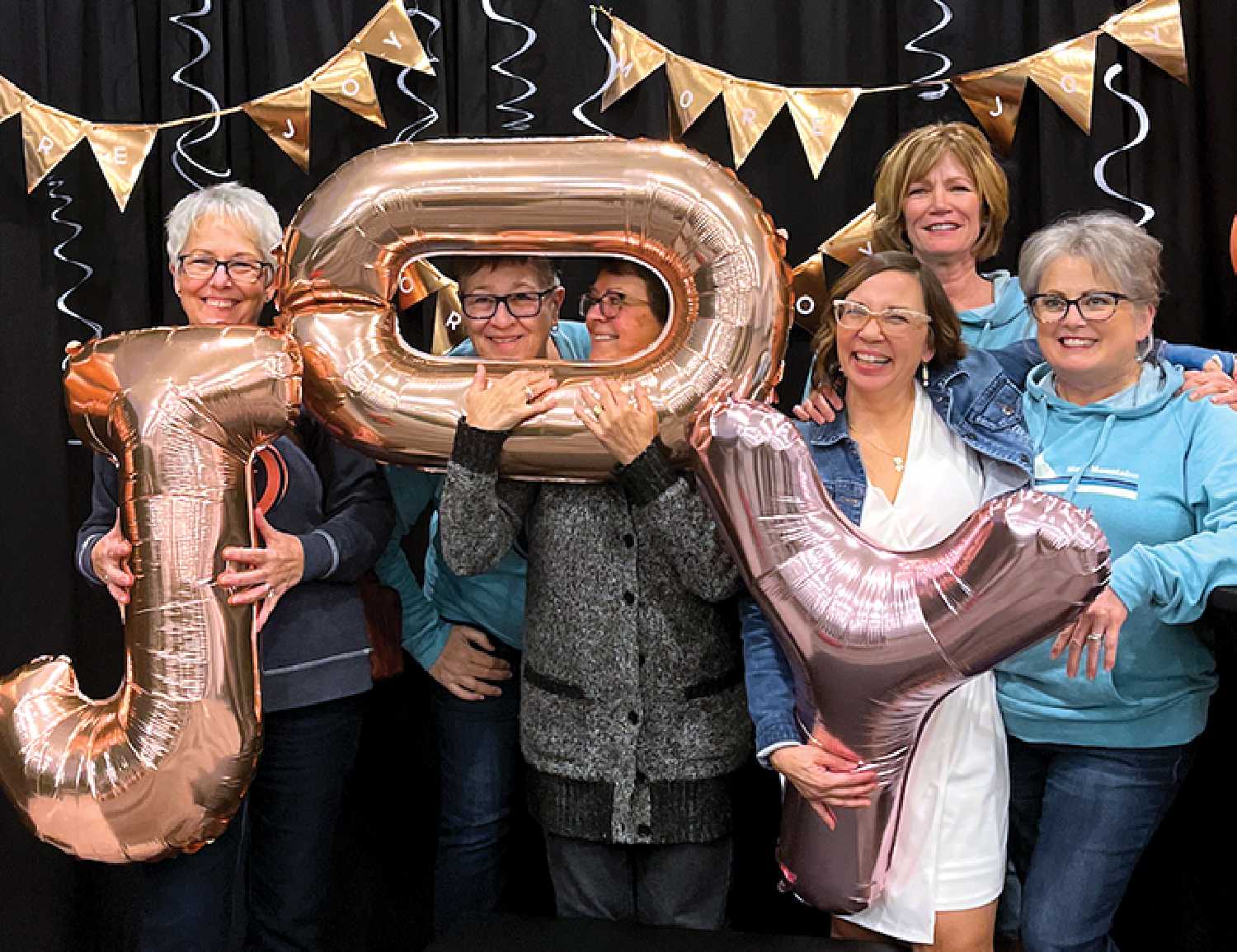 Christalee Froese of Montmartre, third from right, is the organizer of the More Joy event.